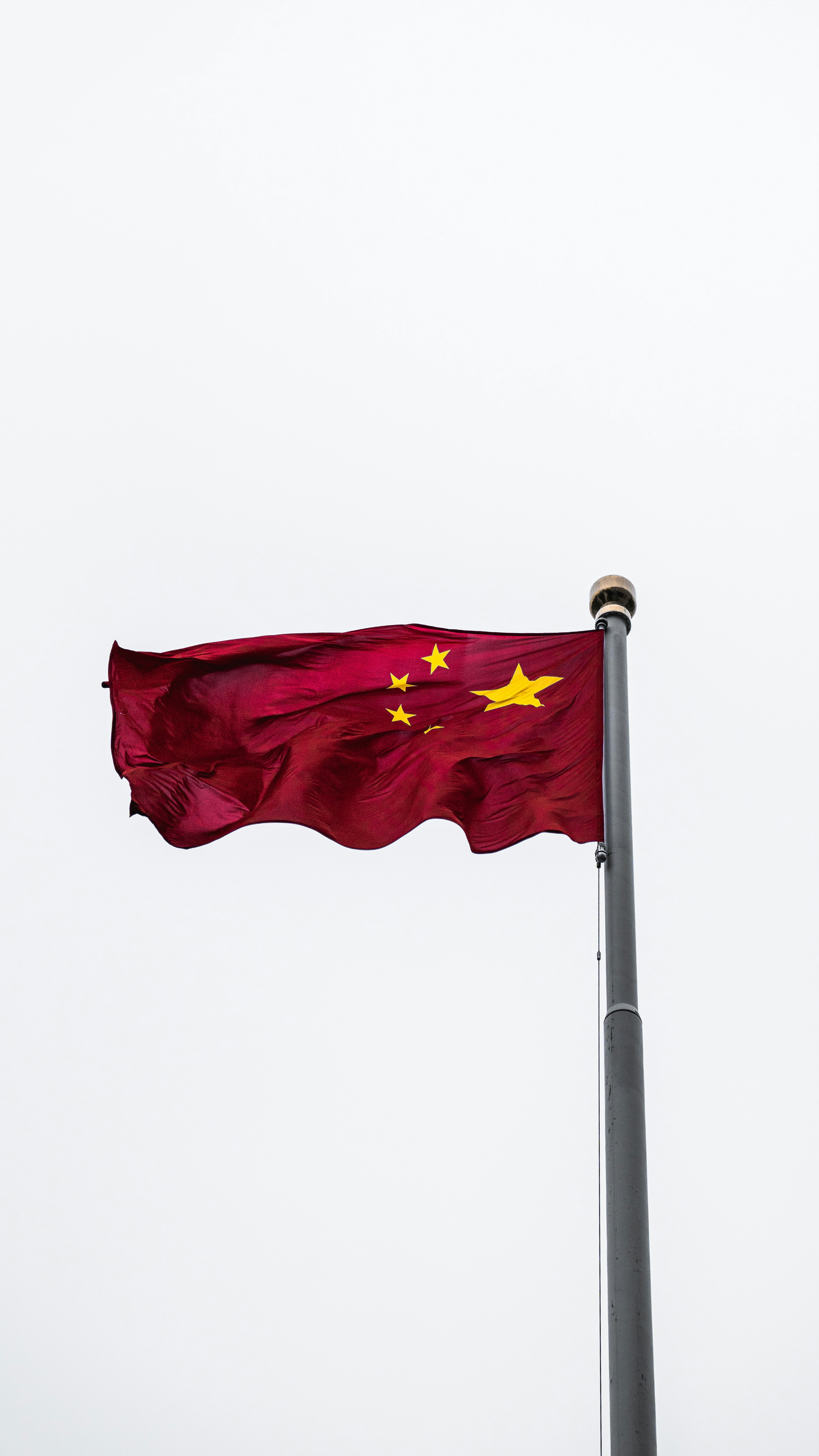 China's flag; image by Alejandro Luengo, via Unsplash.com.