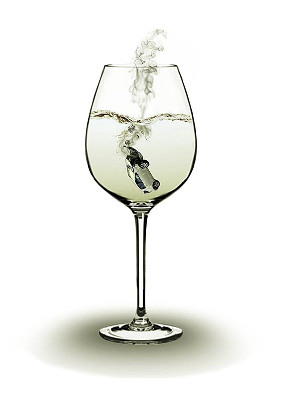 Glass of white wine with car dropped in it; image by TrinidadPhotoshopMan, via Pixabay.com.