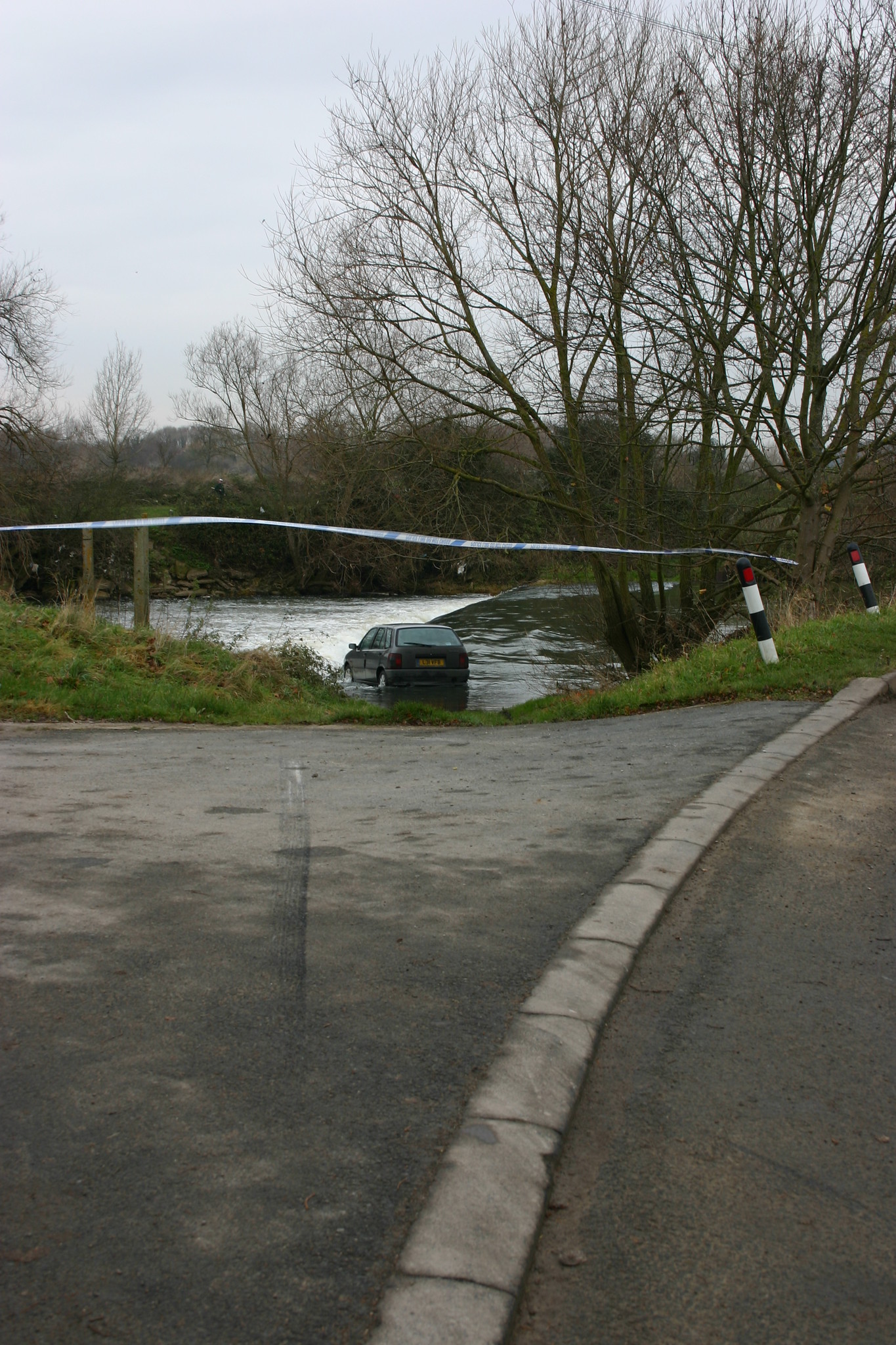 Car accident involving water; image by Jon Whitton, via Flickr.com, CC BY-NC-ND 2.0 Deed, no changes.