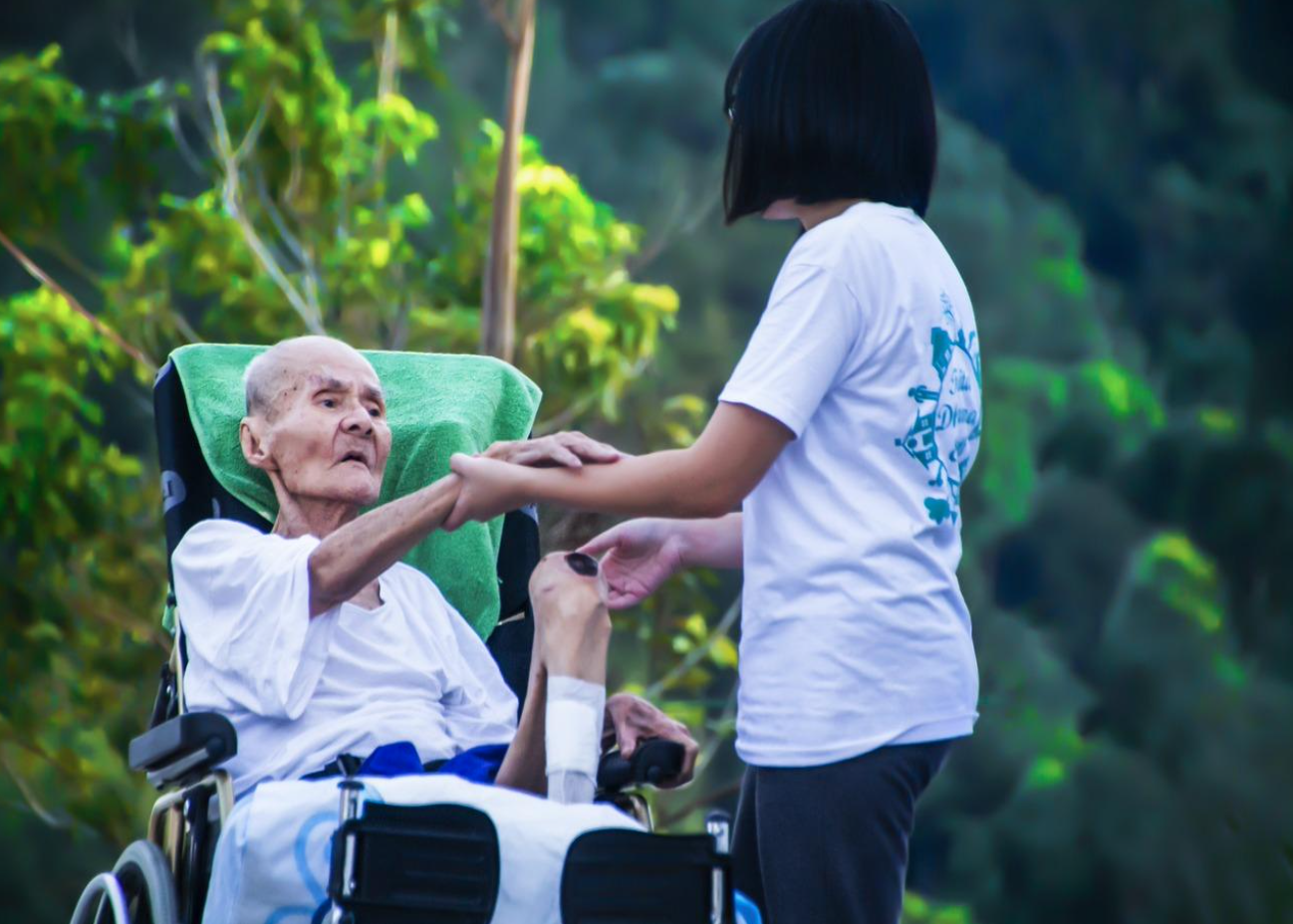 Hospice worker caring for elderly frail patient; image by Truthseeker08, via Pixabay.com.