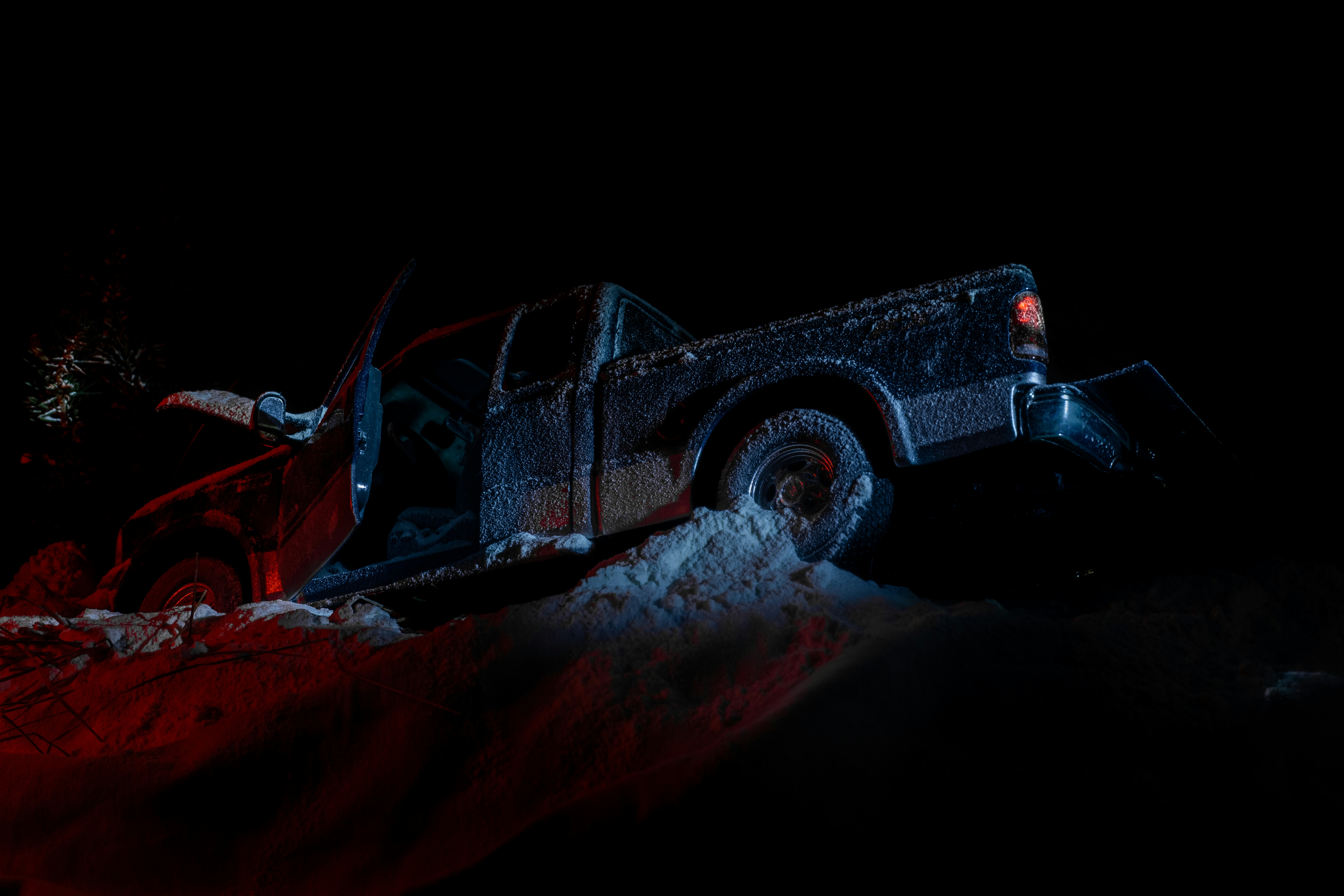 Pickup truck in the ditch, hood up; image by Andrew Petrischev, via Unsplash.com.