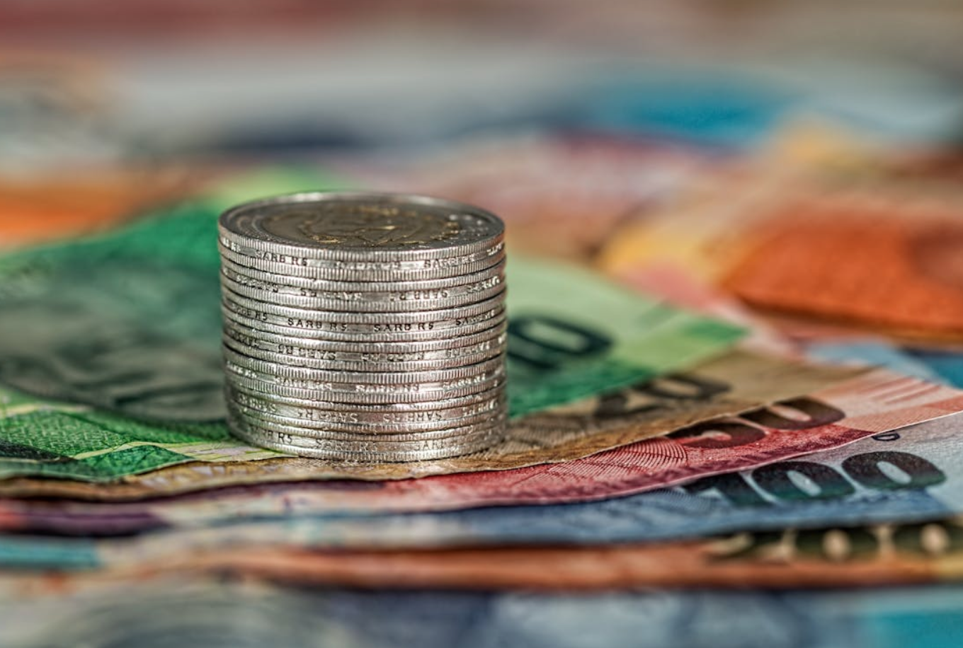Assorted paper money and coins; image by Pixabay.com, via Pexels.com.