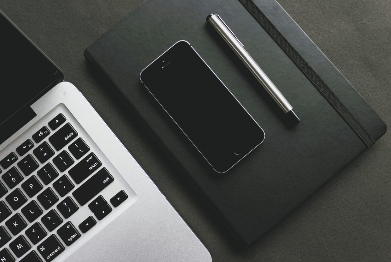 Pen, notebook, and notepad on desk; image by rupixen, via Pixabay.com.