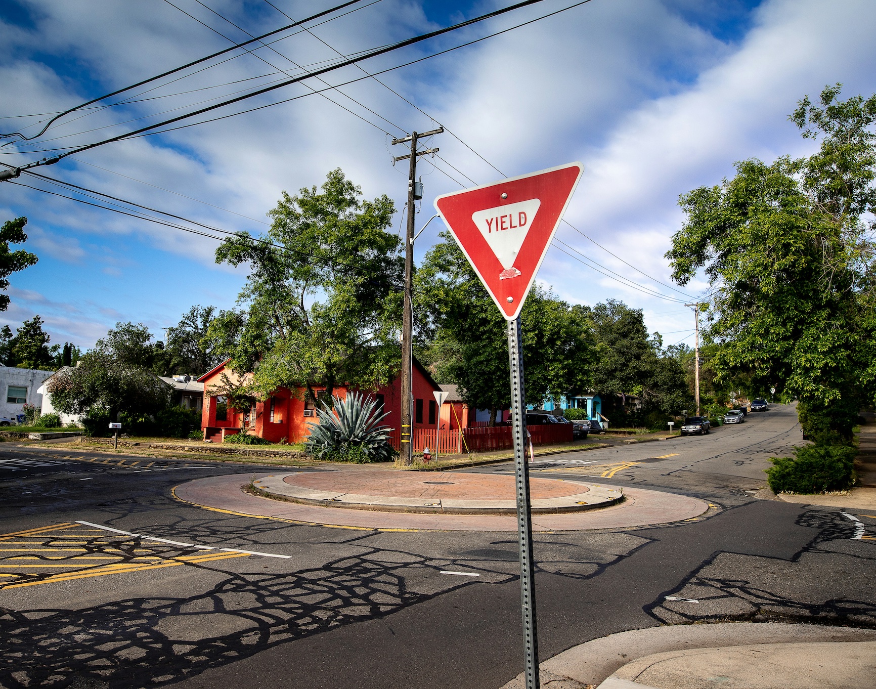 Yield sign at intersection; image by James Coleman, via Unsplash.com.