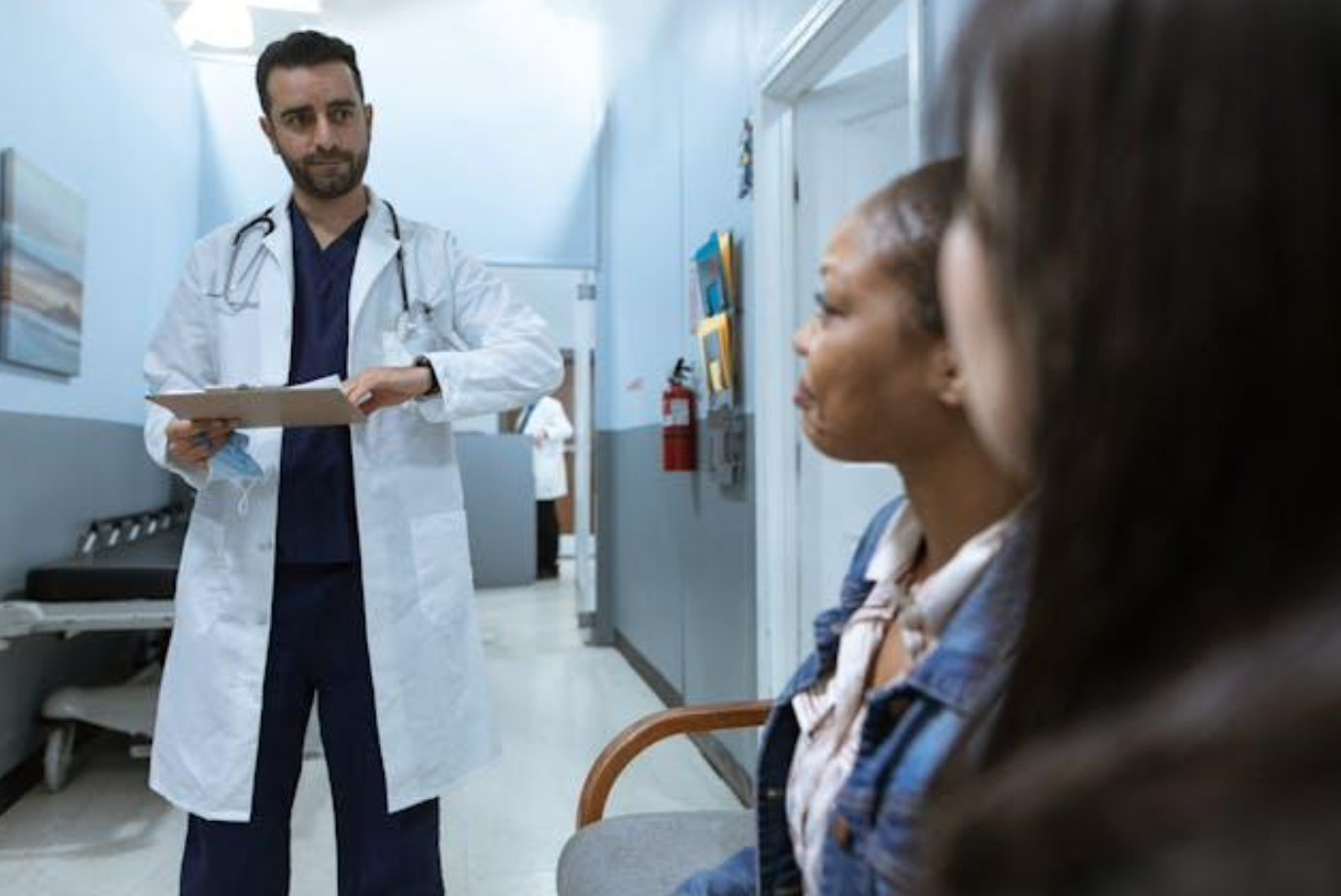 Doctor talking with patient's family; image by RDNE Stock project, via Pexels.com.