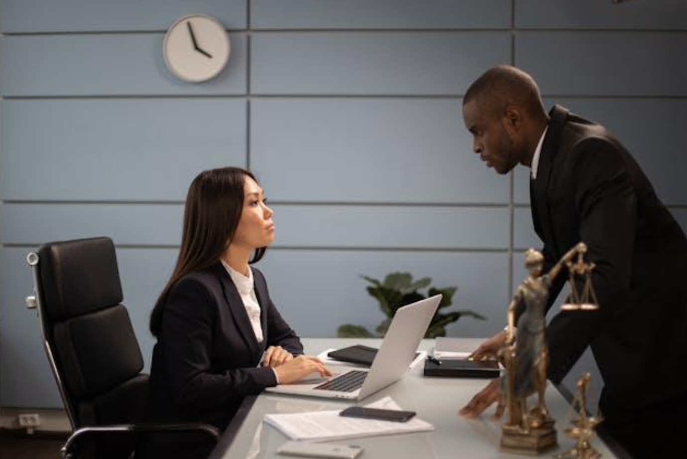 Man and woman in office; image by Katrin Bolovtsova, via Pexels.com.