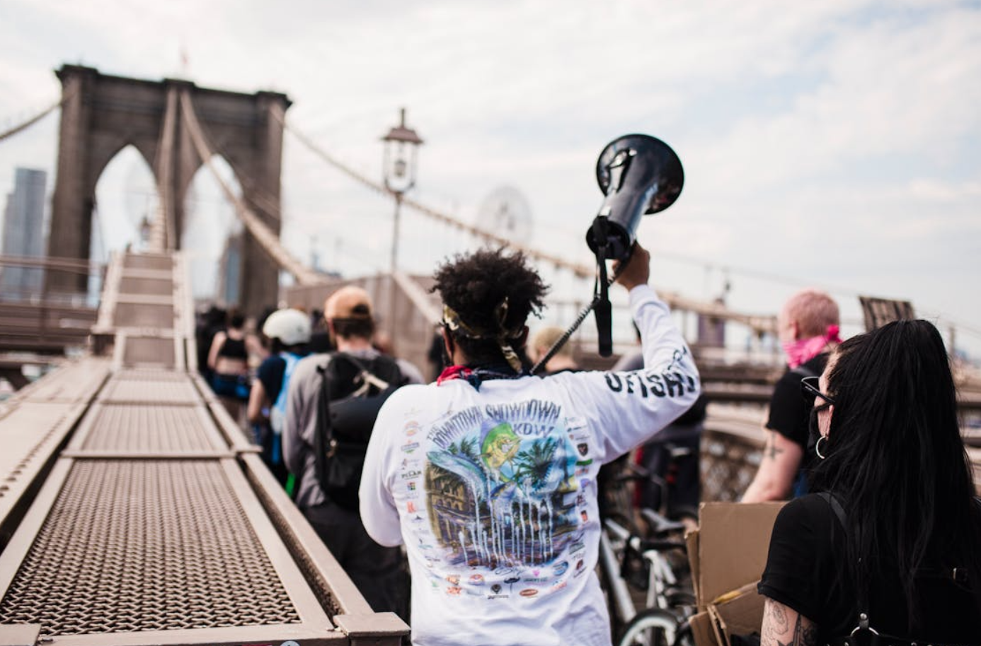 People protesting at the Brooklyn Bridge; image by Life Matters, via Pexels.com.