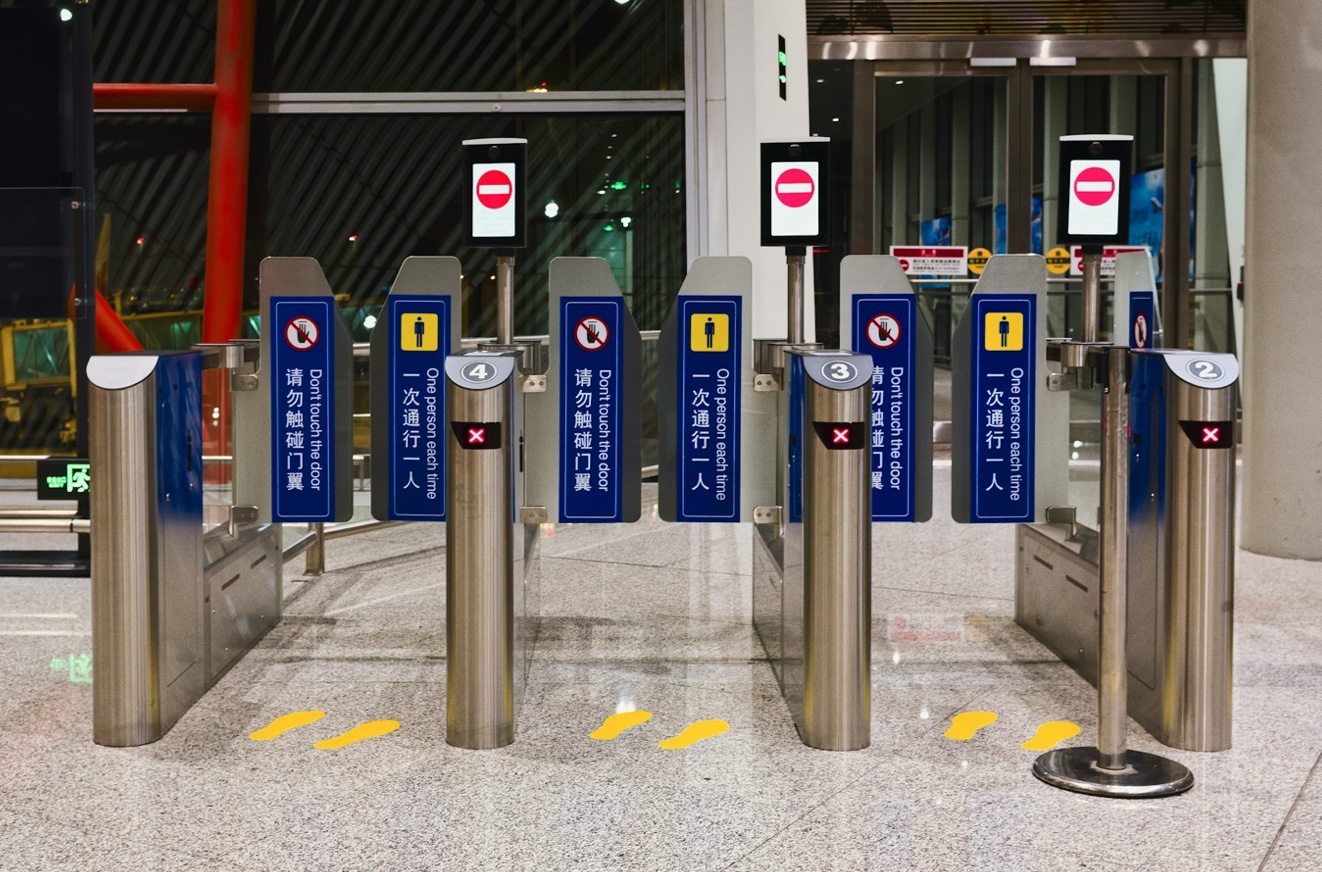 Automated security gates in a modern building entrance.