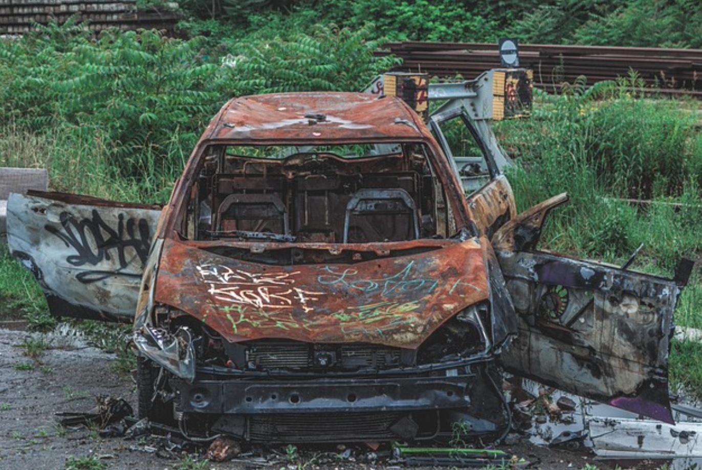 Rusted out car wreck; image by Pixabay, via Pixabay.com.