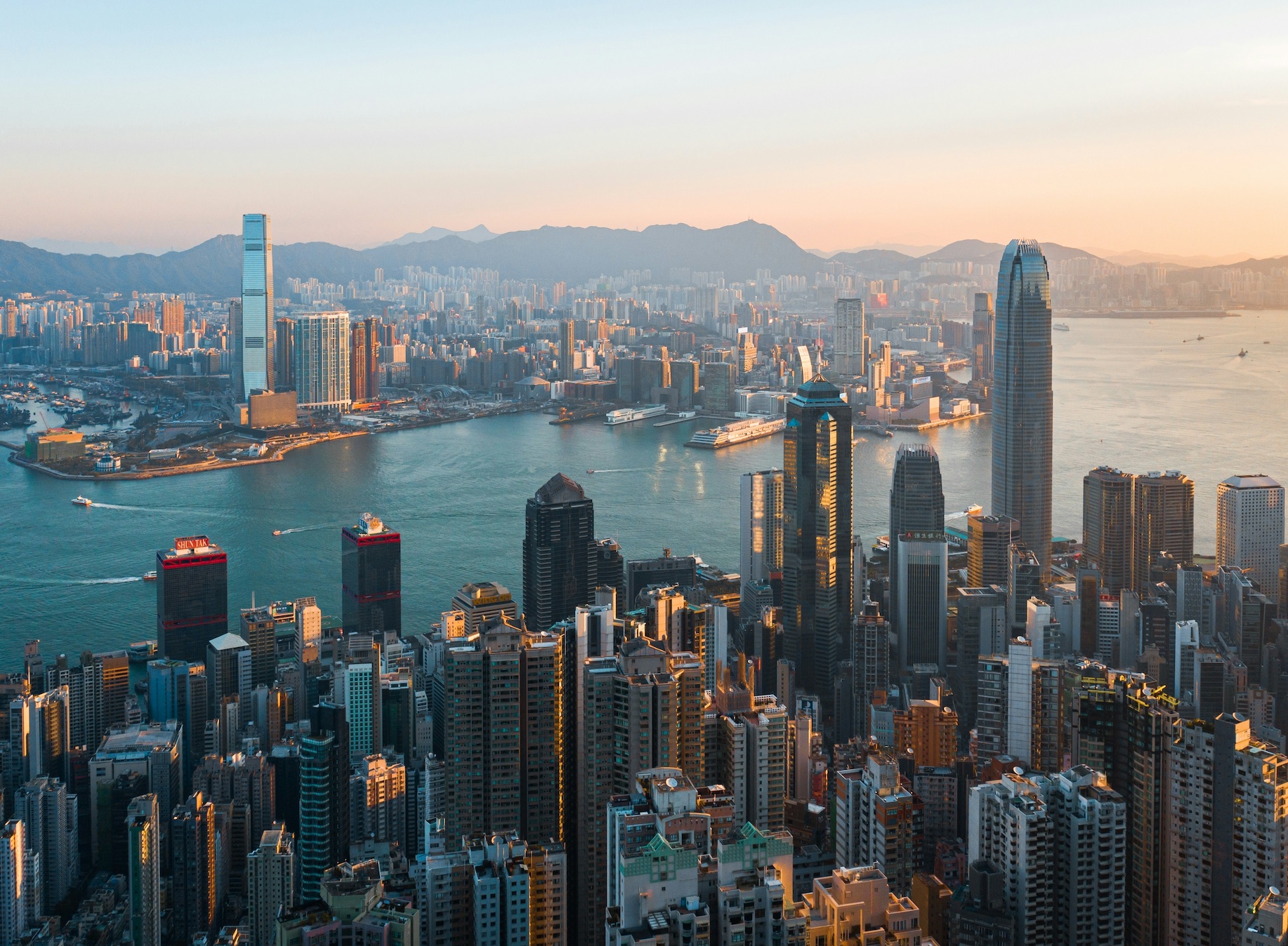 Classic cityscape of Hong Kong during sunrise; image by M, via Unsplash.com.