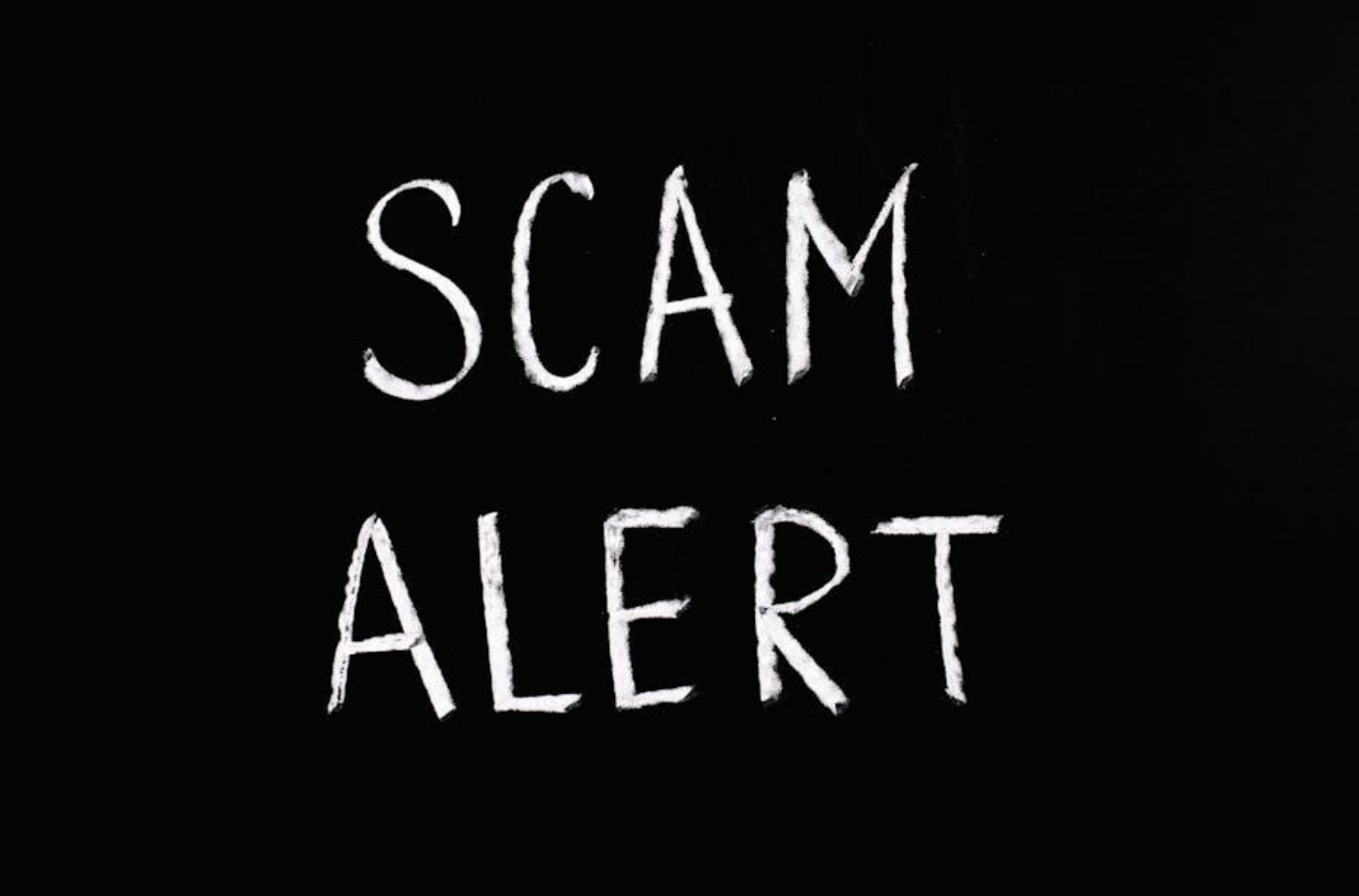 Scam Alert in white text on black background; image by Anna Tarazevich, via Pexels.com.