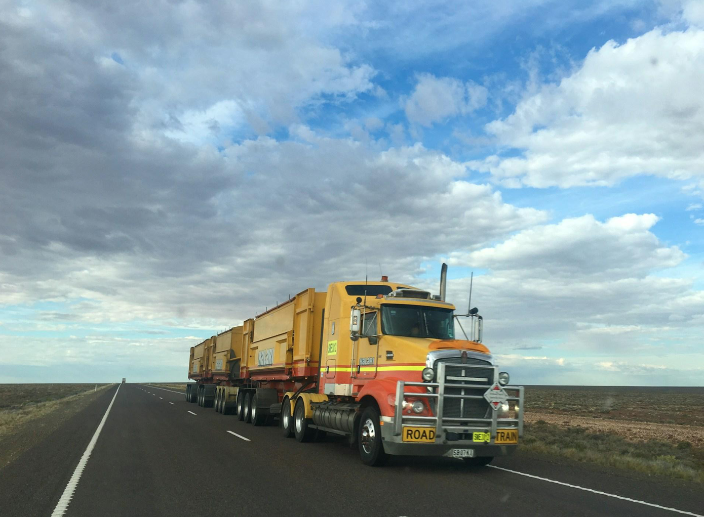 Truck on highway during the day; image by Rhys Moult, via Unsplash.com.