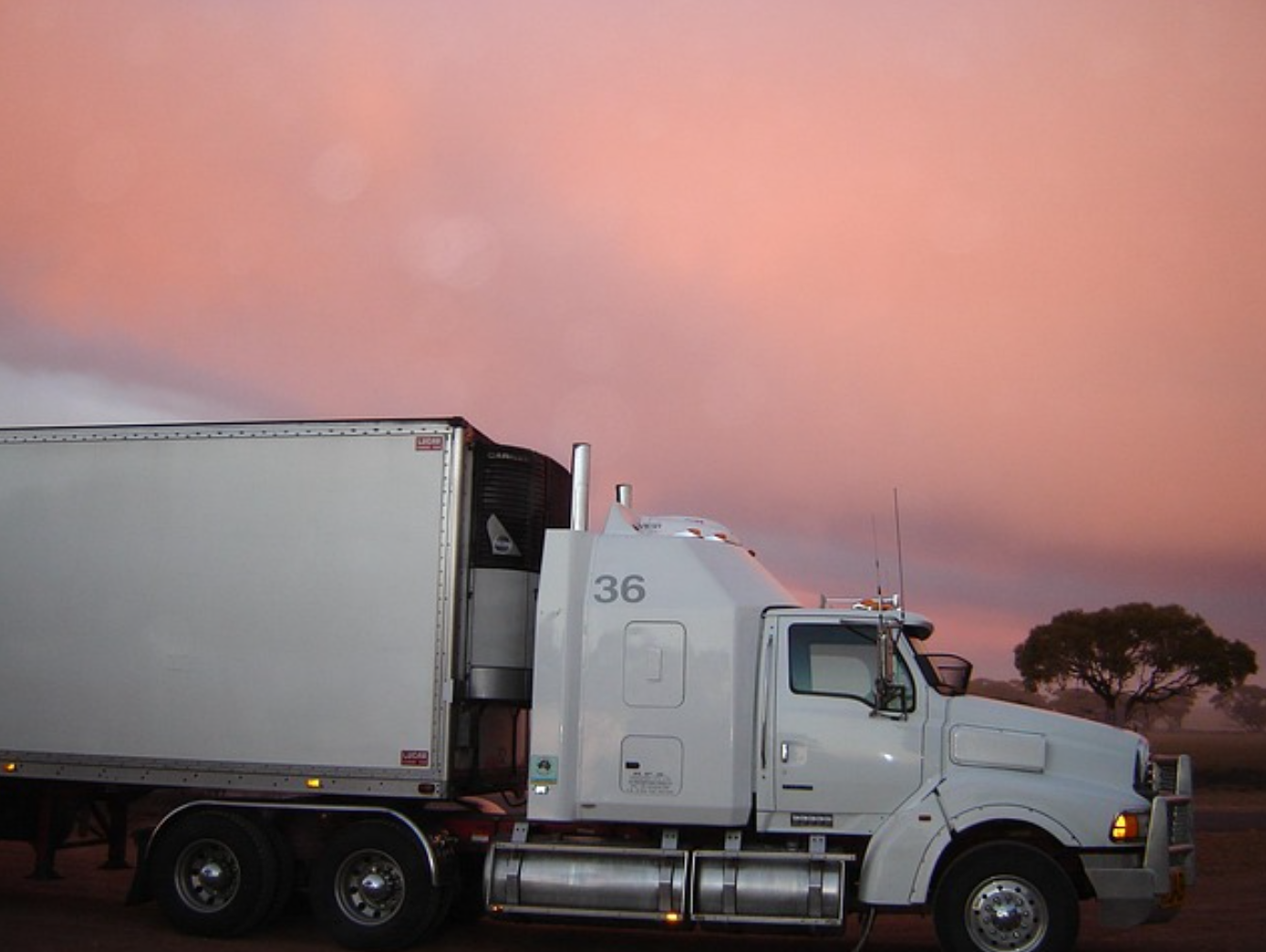 Truck at sunset; image by nessrider12, via Pixabay.com.