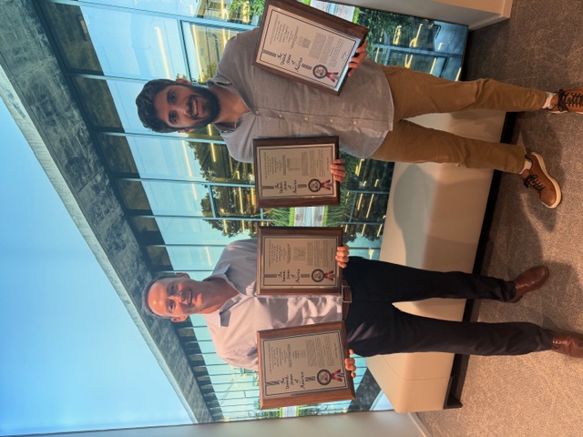 Togal.AI Founder & CEO Patrick Murphy and Togal.AI Co-Founder & Head of Growth, Johnny Maghzal hold framed patents for Togal.AI. Image from press release.
