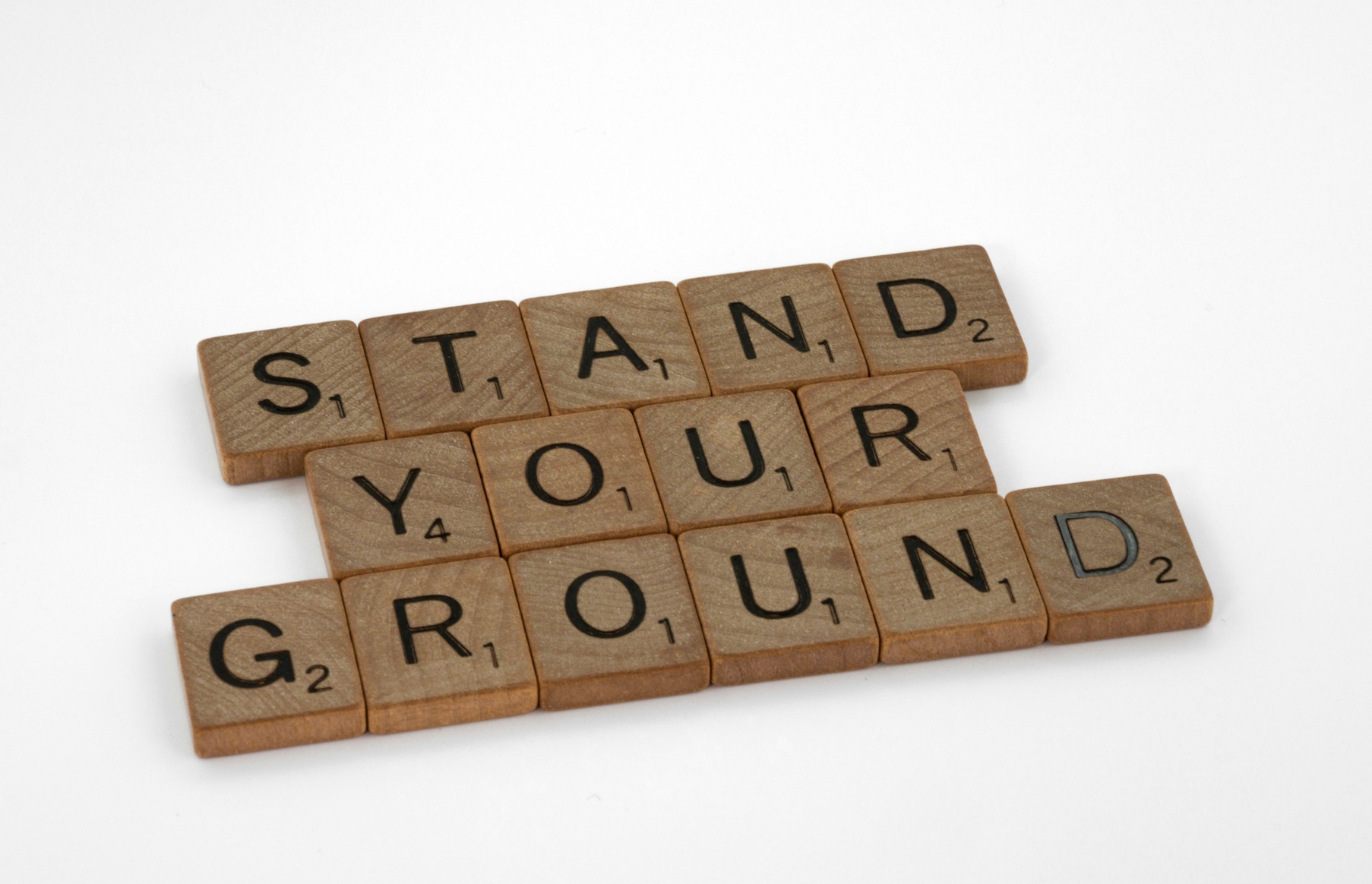 Scrabble tile spelling out the words Stand Your Ground. Image by Brett Jordan, via Unsplash.com.
