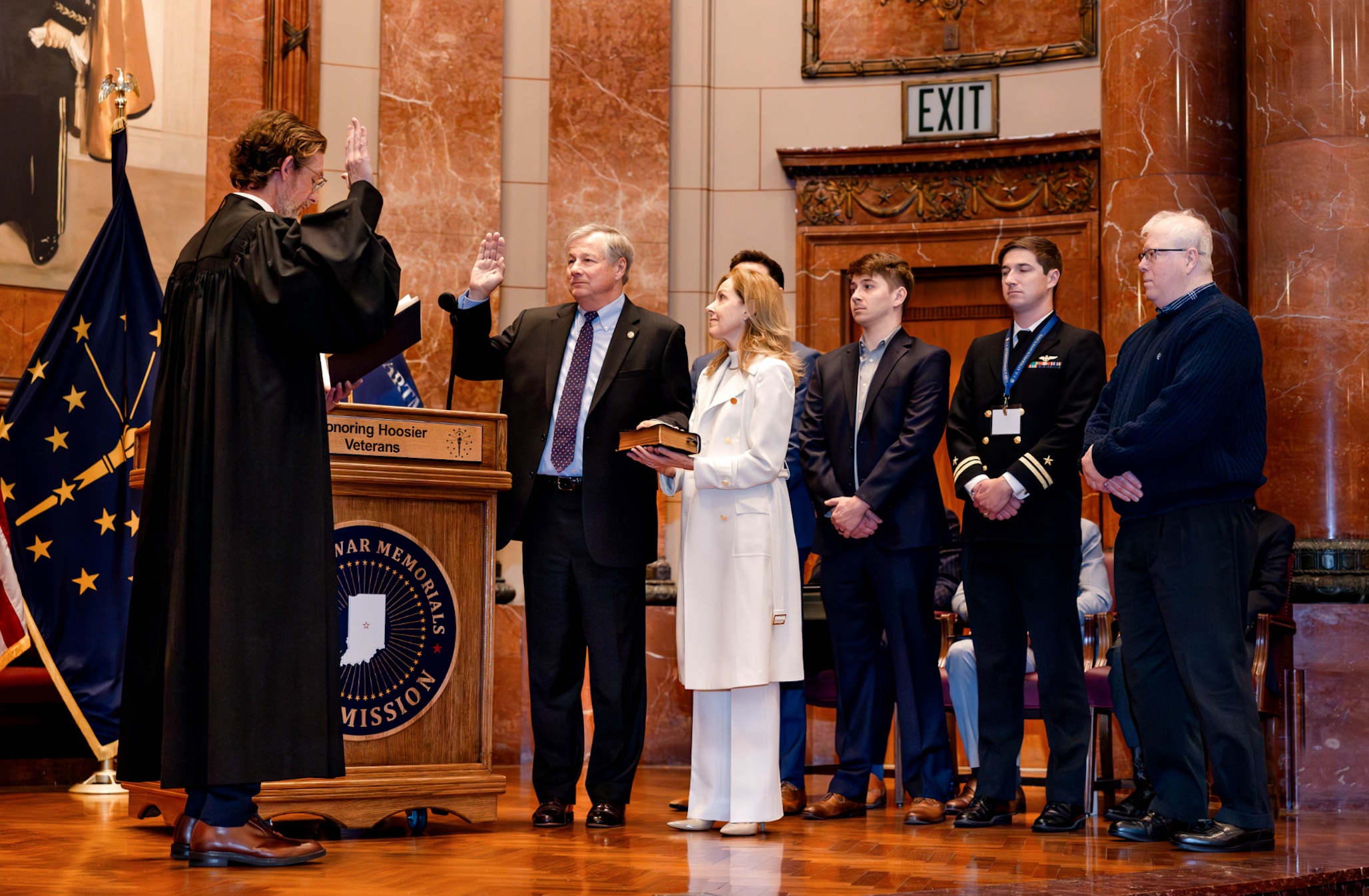 U.S. Attorney Wheeler, joined by his wife and family members, is sworn in by U.S. District Judge James P. Hanlon on stage at the Indiana War Memorial. Image by Hannah Stewart via @Hannah_elizabethphotography_, from press release.