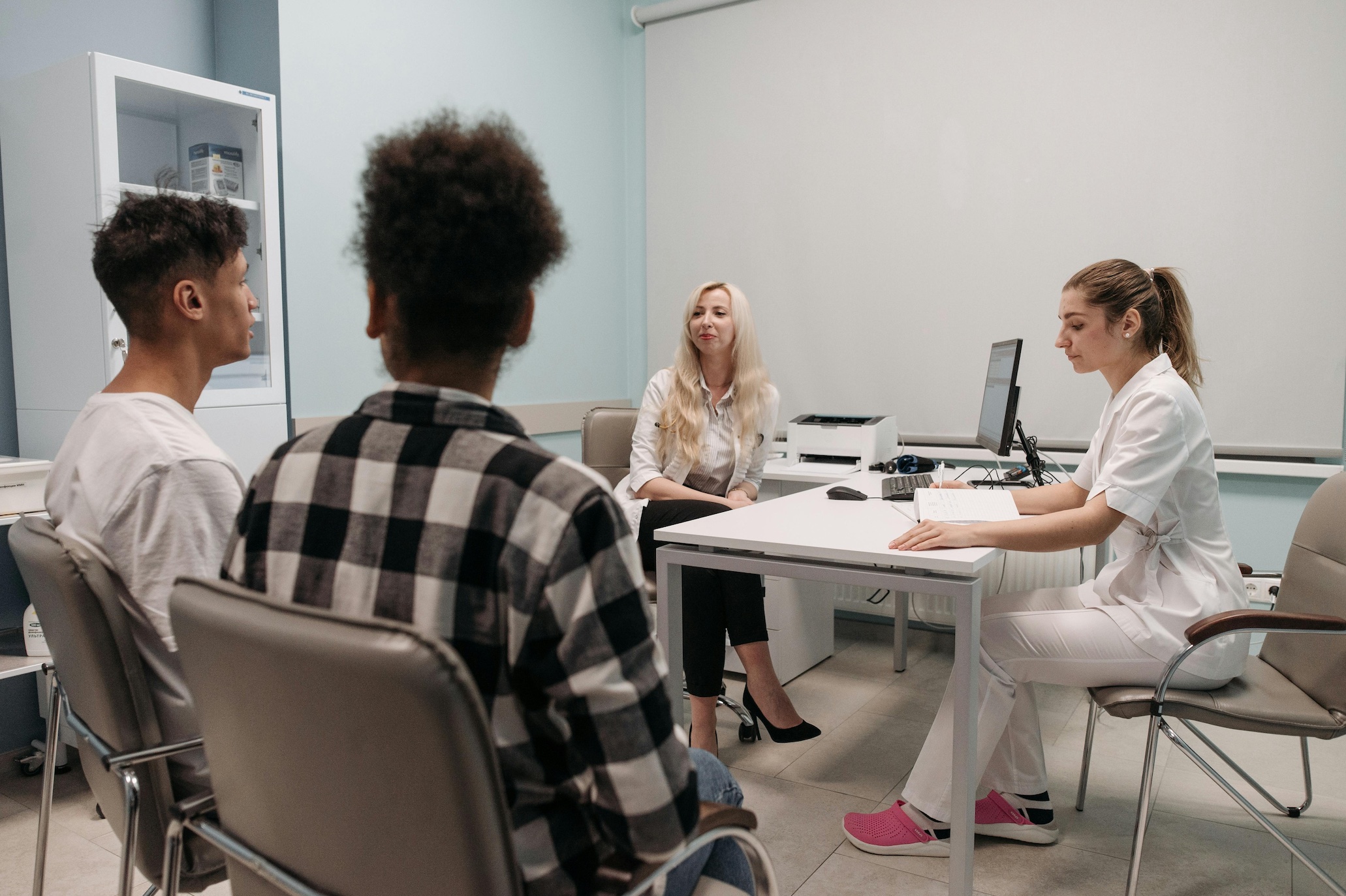 Couple at medical appointment; image by Pavel Danilyuk, via Pexels.com.