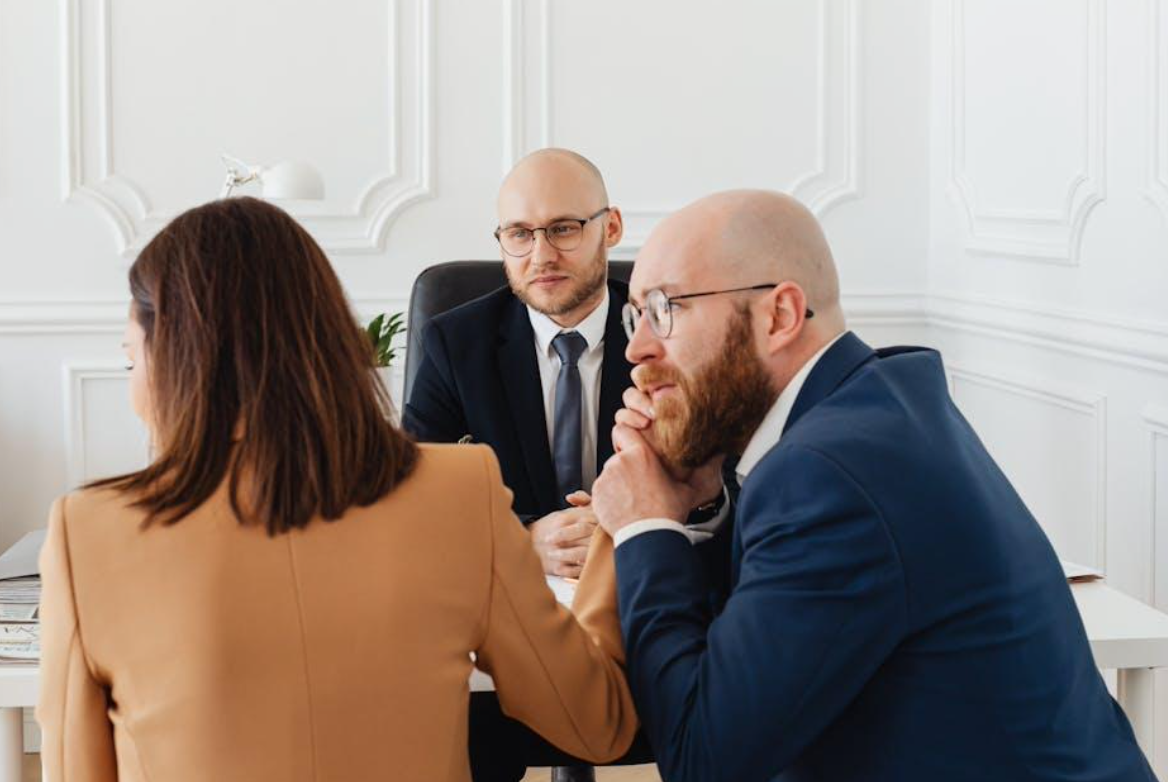 Couple consulting lawyer; image by www.kaboompics.com, via Pexels.com.