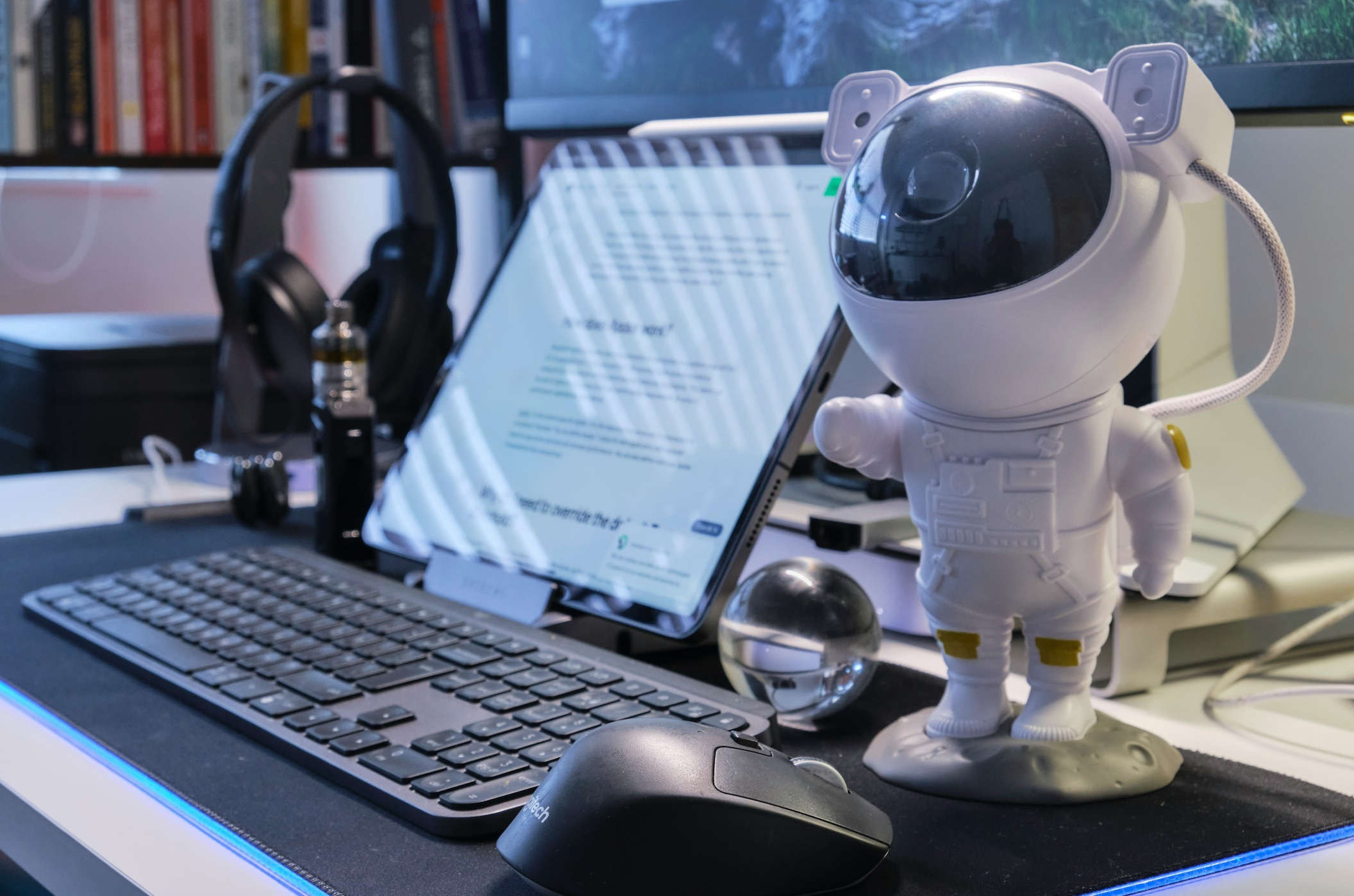Robot standing next to a laptop; image by Boitumelo, via Unsplash.com.