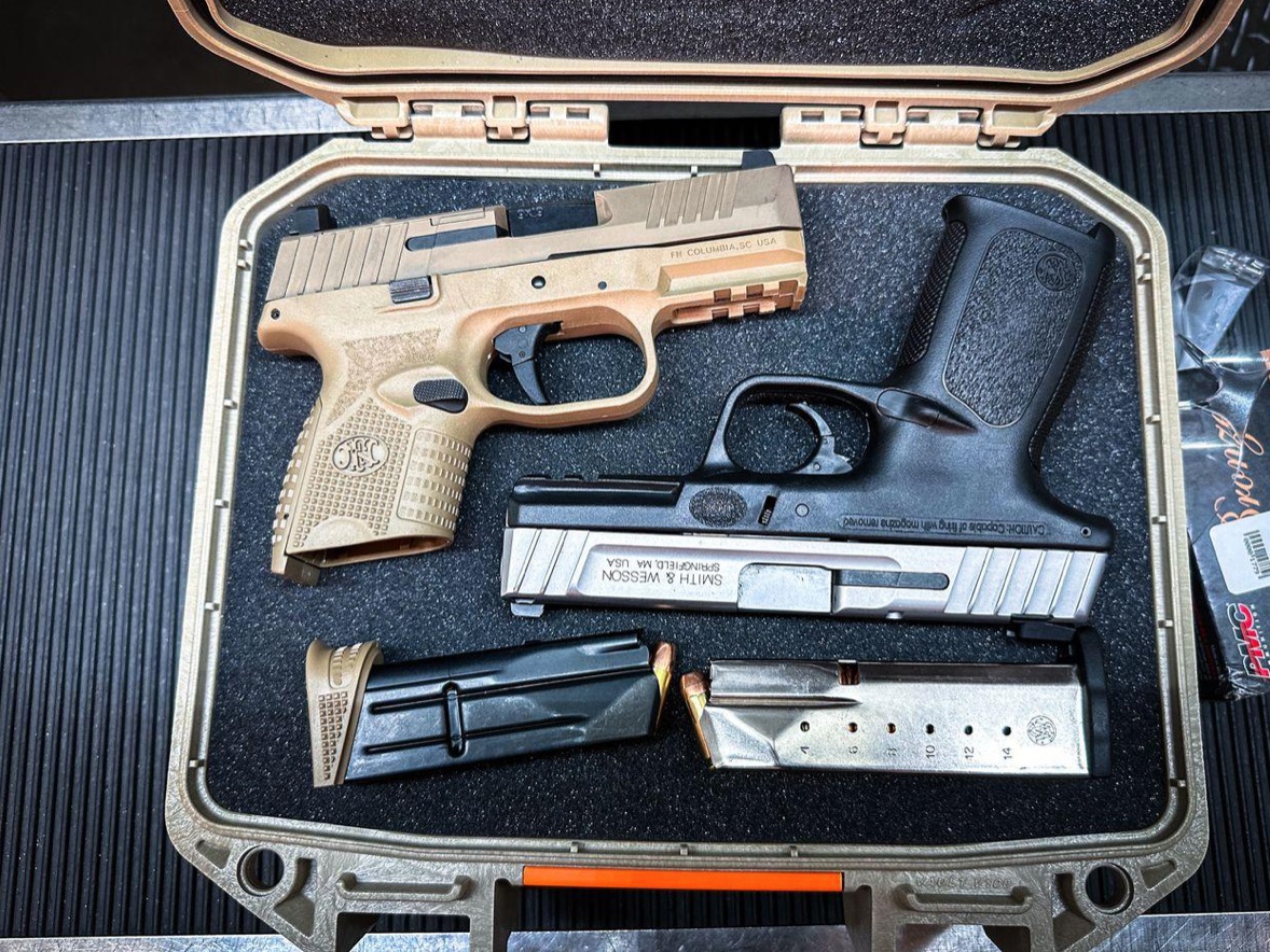 Case full of firearms; image by Terrance Barksdale, via Pexels.com.
