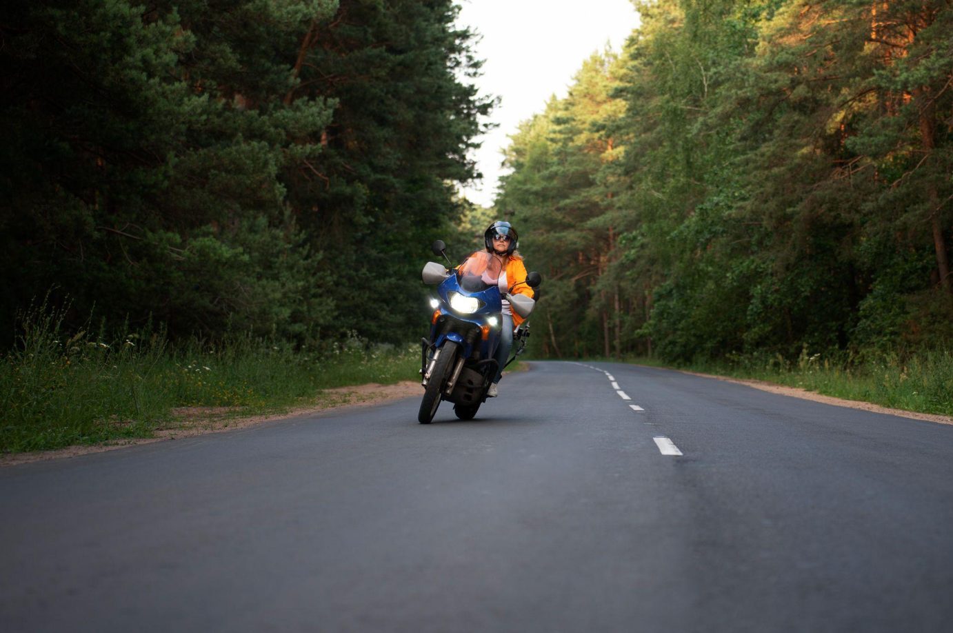 Older woman on motorcycle; image by Freepik, via Magnific.com.