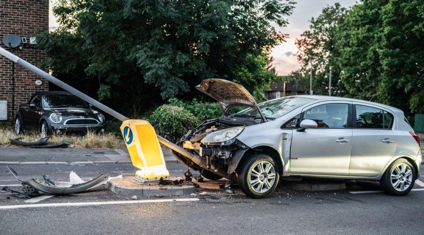 Car crashed into lamp post on London street; image by Boost Media-Marketing, via Pexels.com.